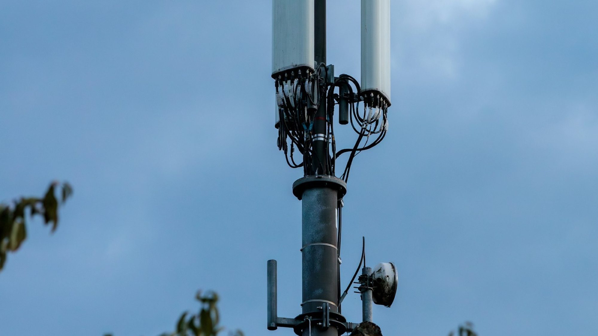 Rooftop small-cell antenna installation in an urban environment.