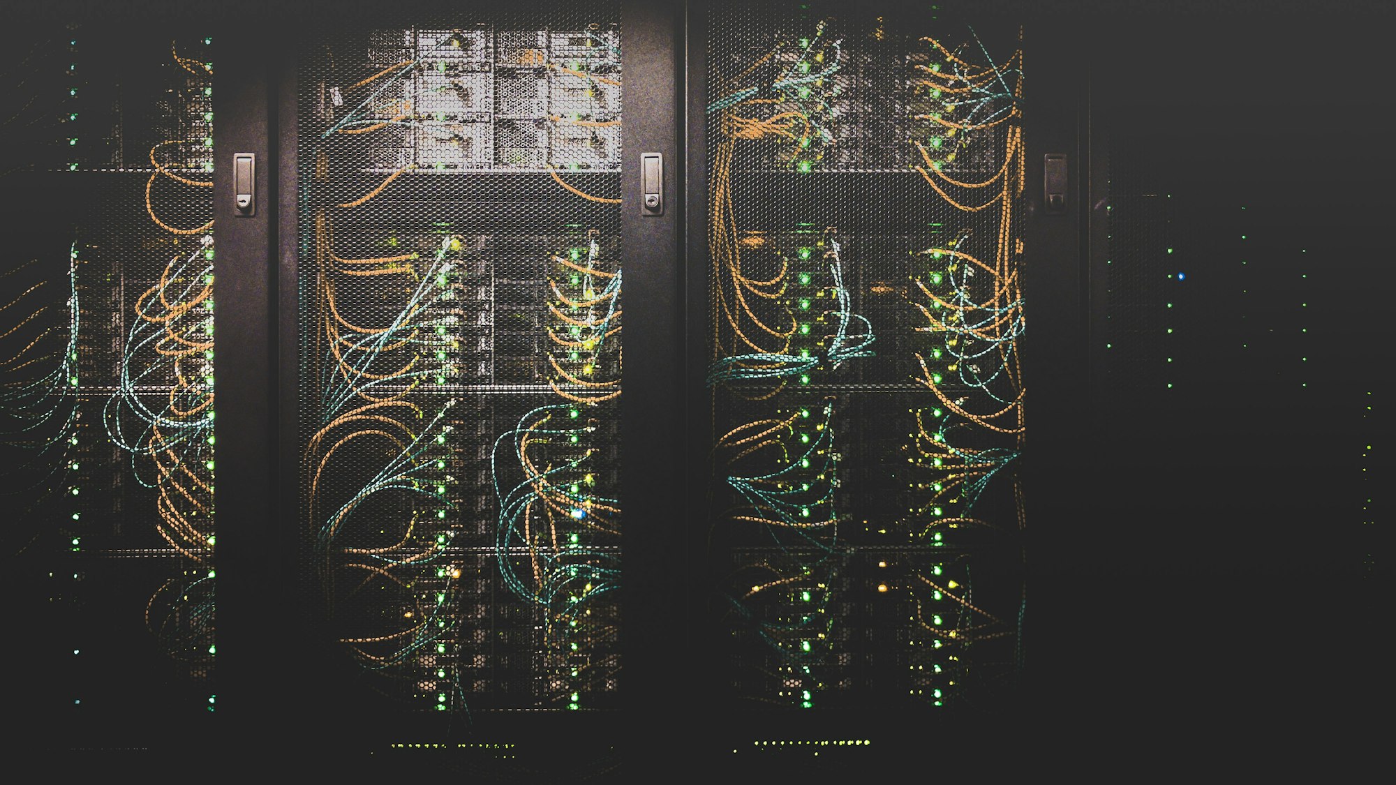 Color-coded structured cabling and pathway in a data hall.