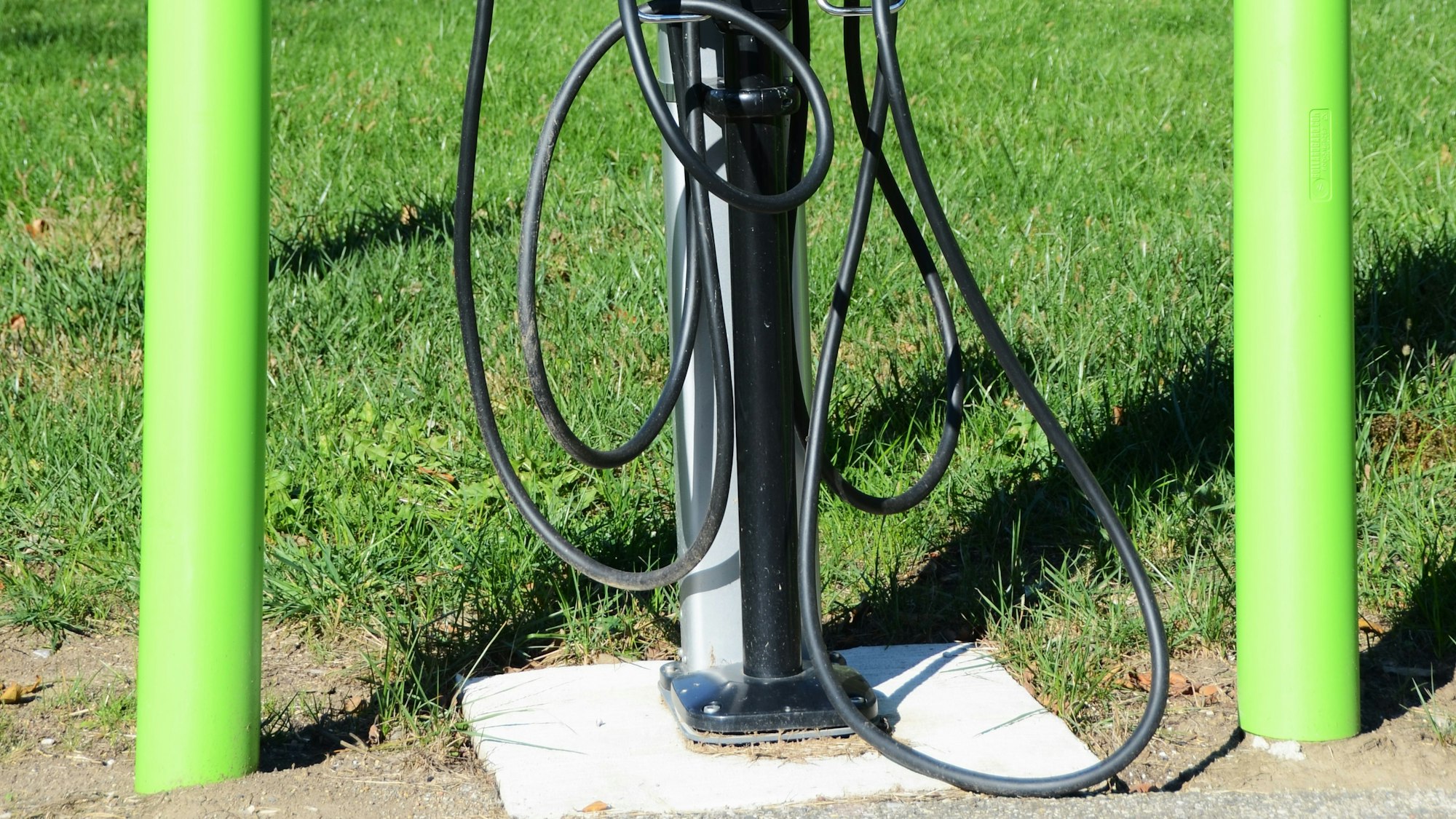 EV charging station with cables representing commercial EV charging infrastructure deployment.